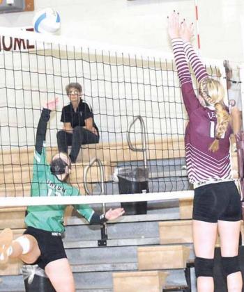 Lewiston’s Meagan Sanders (#17, right) mans the net against Falls City Sacred Heart in Thursday night’s game. The Lady Tigers lost the match in three sets, 7-25, 15-2, 17-25. Paula Jasa/Republican