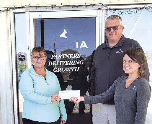 The City of Pawnee City graciously accepted a $1200 donation from Alphia to rebuild the city dog kennels located by the sewer plant on the south edge of town. Pictured left to right are Susan Eisenhauer, City Council Member; Travis Kendall, Alphia Site Director and Megan Bloedorn, Alphia HR Manager at the Pawnee City facility.