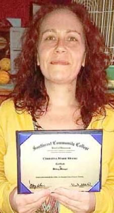 Tina Moore gets degree for her job as hospital head cook