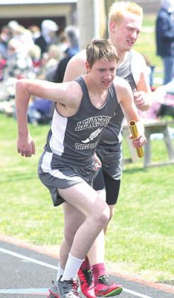 Lewiston’s Johnathan Burgett takes the handoff from teammate Jon Janssen in the 3200 M. Relay. Paula Jasa/Republican