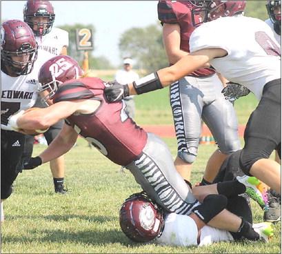 LHS’ Tristen Ray (#25, center) dives for more yardage past three St. Edward defenders. Ray had 119 yards of rushing with 3 TD’s against the Beavers. Paula Jasa/Republican