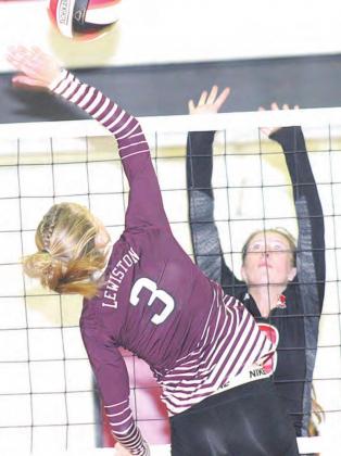 LHS’ Katelyn Sanders goes up at the net against P.C.’s Hallye Friedly (#8) in Thursday night’s game. Paula Jasa/Republican
