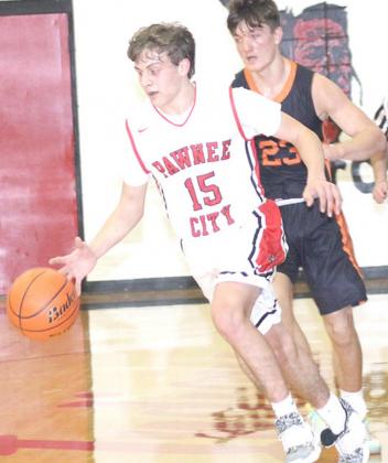 P.C’s Kaden Lang (#15, left) brings the ball down. Paula Jasa/Republican
