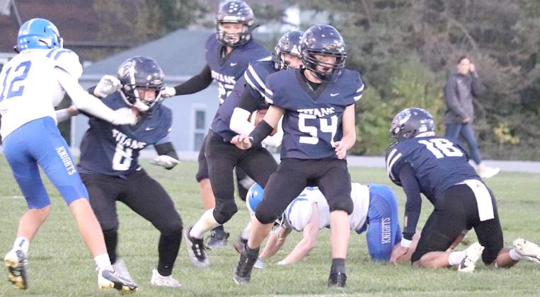 The HTRS Titans hosted the Nebraska City Lourdes in a very high-scoring game for Homecoming on Friday night, October 7th. Unfortunately, the Titans lost by a 50-68 count. Pictured are some of the HTRS offensive players including Emmett Glathar (#9), Hunter Bohling (#22), Brogan Dunlap (center); Jonathan Koch (#54) and Brandt Leech (#18, right). photo courtesy of Kelly Glathar