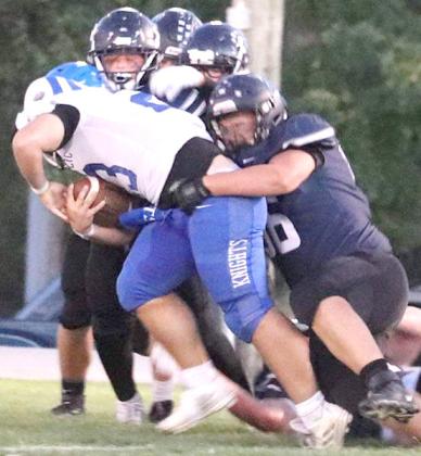 HTRS’ TY Faulks wraps up an NCL ball-carrier in Friday’s Homecoming action. Faulks recorded 8 tackles. photo courtesy of Kelly Glathar