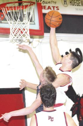 P.C.’s Anthony Kling scores two of his 24 points against HTRS on Tuesday night. Paula Jasa/Republican
