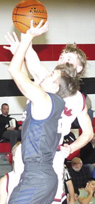 P.C.’s Justin Pierce blocks HTRS’ Brennen Vaughan on a shot early. Paula Jasa/Republican