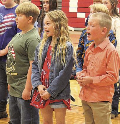 Pawnee City 4th and 5th graders sing 'Lady Liberty' at the Pawnee City Public School Veterans' Day Program
