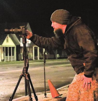 Delton Rhodes at work photographing in Pawnee City. Ray Kappel/Republican