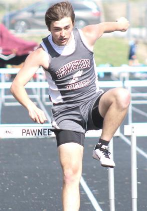 LHS’ Brady Bledsaw clears his final hurdle of the boys’ 300 M. event. Paula Jasa/Republican