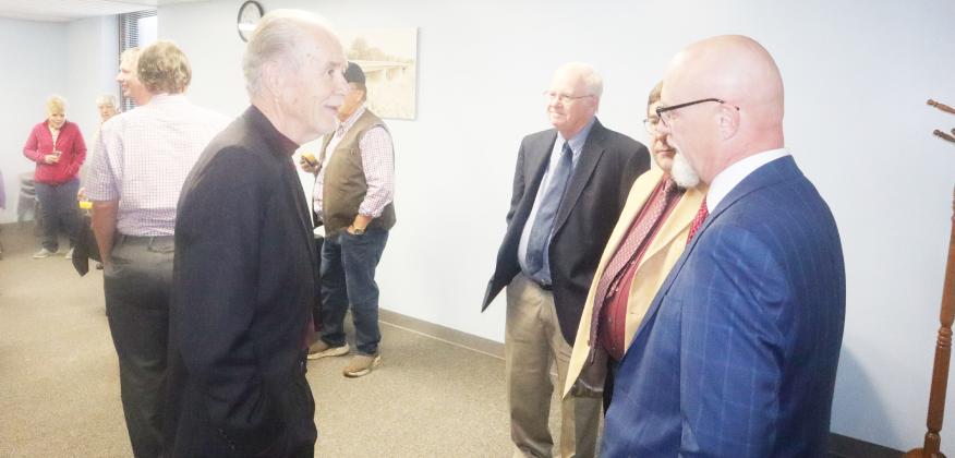 Photos By Ray Kappel Vic Faesser talking to local members of the community and other members in the law community at his retirement party held at the courthouse October 7th