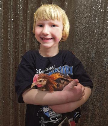 Above: Rosie Winkinhofer, age 6, with one of her favorite chickens