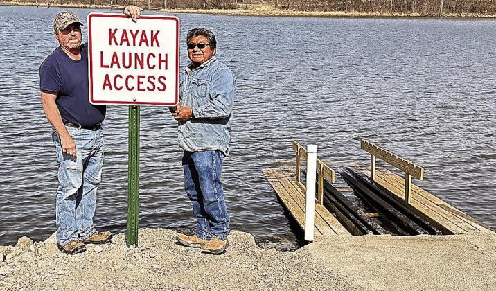 Last week, NRD workers Tomas Chale, Ken Hattun, and Aaron Stalder installed the launch at Iron Horse. On Friday, they returned and Tomas and Ken installed a sign. Photo by Sharla Sitzman