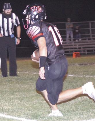 P.C.’s Anthony Kling (#16) returns an interception 37 yards for a touchdown against Lewiston on Friday night as the official watches on the change of possession. Paula Jasa/Republican