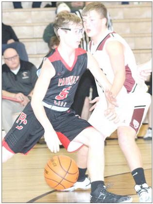 P.C.’s Justin Pierce (#5, left) tries to drive past LHS’ Everett Bohling in last Tuesday night’s game. Paula Jasa/Republican