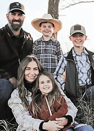 The Johnson Family Back row is Brady, Stetson then Rhett.Front row is Cortney with Rowan on her lap