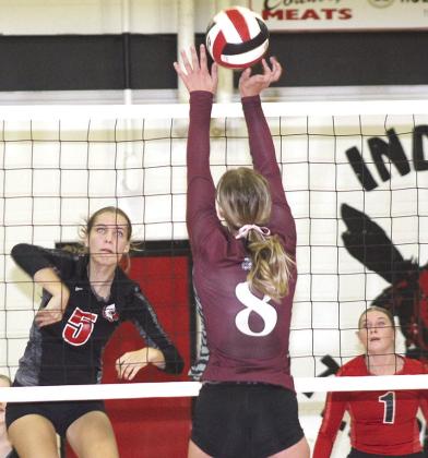 P.C.’s. Emalyse Gottula (#5, left) powers a spike against LHS’ Maddie Janssen (#8, center) while teammate Cameron Ottersberg (#1, right) looks on. Paula Jasa/Republican