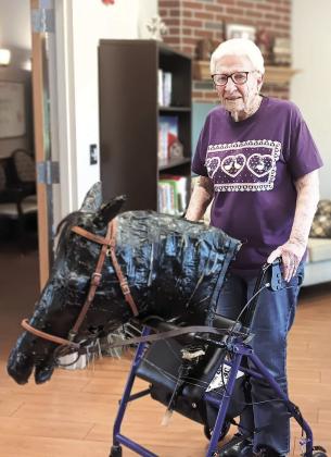 Opal Rule with her beloved papier-mache horse head