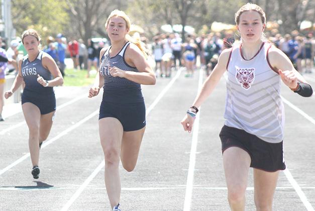 Lewiston’s Katelyn Sanders (right) finishes ahead of HTRS’ Elie Bstandig (center) and Shayfer Cumro (left) in the prelims of the girls’ 100 M. Dash. Paula Jasa/Republican