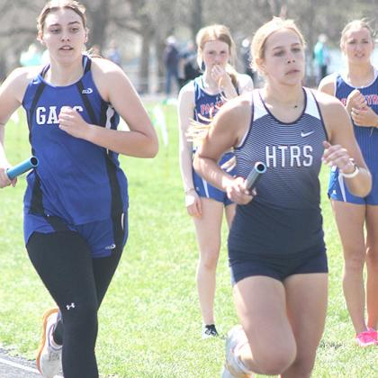 HTRS’ Laramie Glathar (right) keeps her pace in the 3200 M. Relay event. Paula Jasa/Republican