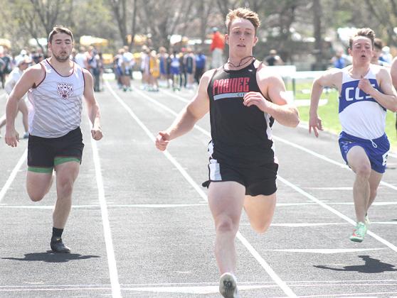 Pawnee City’s Andy Maloley (center) crosses the finish line first ahead of Lewiston’s Brady Bledsaw (left) in the prelims of the 100 M. Dash. Maloley placed 3rd at 11.46. Paula Jasa/Republican