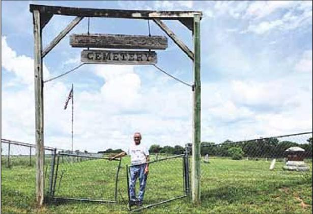 Shad Gager at the Clear Creek Cemetery entrance Sharla Sitzman Photo