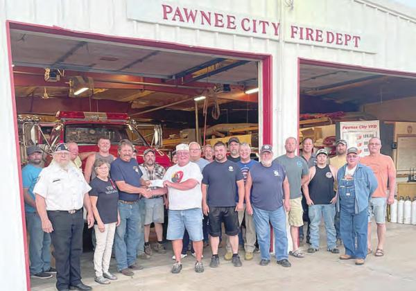 The VFW and Auxiliary presented a check for $2,025 to the Pawnee City Fire Department Tuesday night. The check was the amount raised from the recent fundraiser held at the Blazin’ Bull. The money will go toward the new fire station. Ray Kappel/Republican