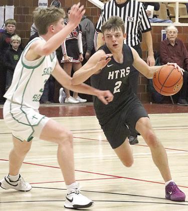 HTRS’ Brennen Vaughan (#2, right) drives the paint against FCSH in the Class B Championship game. Paula Jasa/Republican