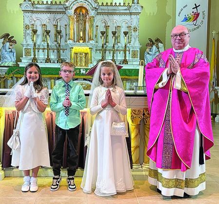 St. Anthonys - Oakley Antholz, Brantly Thiemann, Hazel Tyler and Father Christensen.