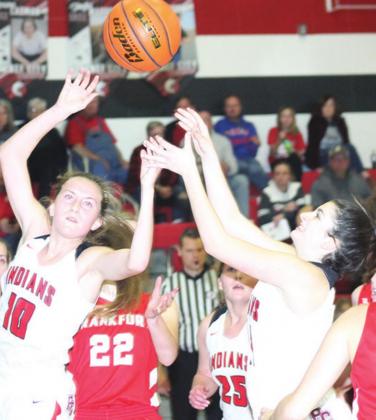 P.C.’s Neveah Blecha (right) puts up a shot as teammates Emily Lytle (#10 and Cameron Ottersberg (#25) look on. Blecha scored 4 points against Frankfort. Paula Jasa/Republican