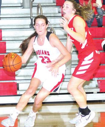 P.C.’s Madison Lytle (#23, left) makes a move on the baseline against Frankfort in Friday night’s game. Paula Jasa/Republican