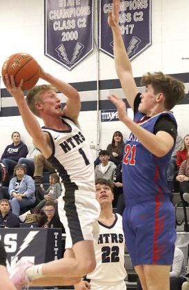 HTRS Brogan Dunlap (#1) drives the lane against Palmyra as teammate Hunter Bohling (#22) looks on. Paula Jasa/Republican