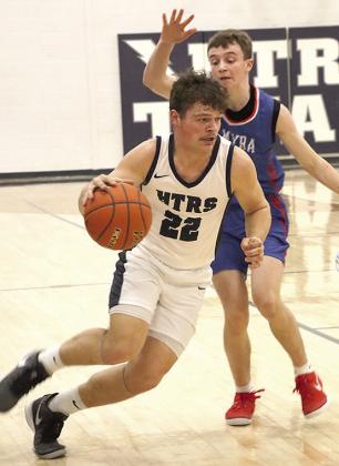 HTRS’ Hunter Bohling (#22) drives past a Palmyra player in the Titans’ final regular season game. Paula Jasa/Republican