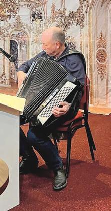 Jim Masty of Dwight plays accordion.