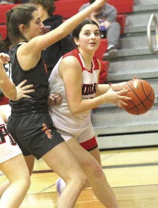 P.C.’s Neveah Blecha (right) drives the baseline against Diller/Odell in Thursday night’s season opener. Paula Jasa/Republican