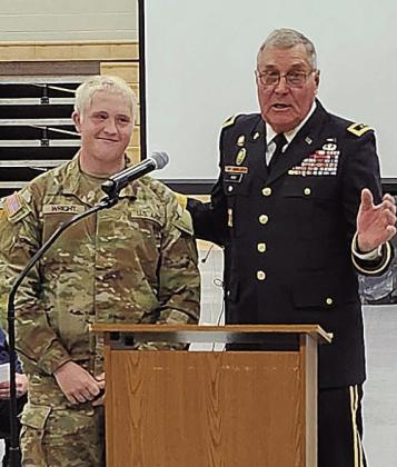 Brody Wright (left) received recognition from Jim Barr (right) at his school's Veterans' Day ceremony last fall