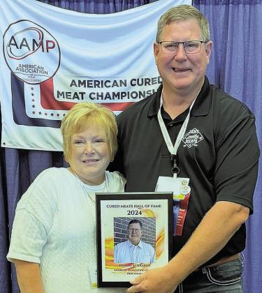 Dennis, pictured with wife Kim, after being inducted into the Cured Meats Hall of Fame.