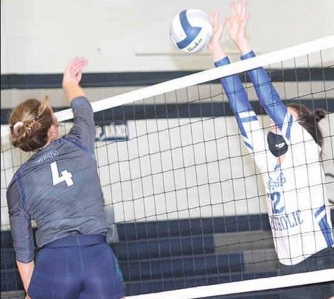 HTRS’ Natalie Novak (#4, above) powers a spike through NCL’s defense while Katilyn Glathar (#11) and Aly Howe (#2) go up for a block on defense (below). Paula Jasa/Republican