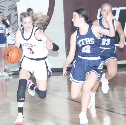Lewiston’s Katelyn Sanders (#3, left) brings the ball down the court against HTRS’ Lillian Bowen (#22, right) in last Tuesday night’s game. Sanders scored her 1,000th career point at Lewiston and amassed 32 total points in LHS’ 64-31 victory over HTRS. Paula Jasa/Republican