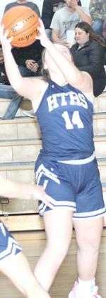 HTRS’ Ashton Bredemeier (#14) pulls in a defensive rebound against LHS. Paula Jasa/Republican