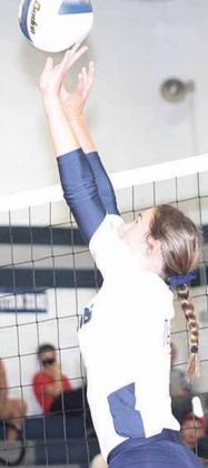 Lewiston’s Katelynn Sanders (#3) (above right) takes a swing against HTRS’ Jacey Leech (#10) in Tuesday night action while HTRS setter Natalie Novak (pictured above right) sets up the Lady Titans’ offense. Paula Jasa/Republican