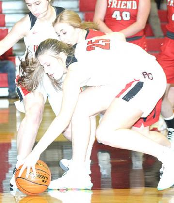 P.C.’s Madison Branek (#25, right) goes for a loose ball on the baseline against Friend on Friday night. Paula Jasa/Republican