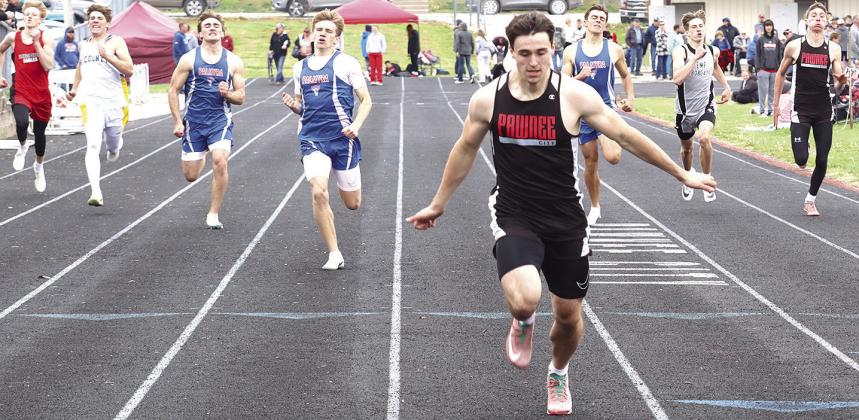 Pawnee City’s Jett Farwell (center) blasted the field in the boys’ 400 M. Dash for a record-setting time of 50.37. Also pictured is Drew Menninga (far right) who finished 7th clocked at 53.90. Paula Jasa/Republican