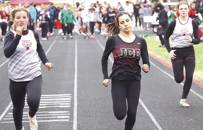 Lewiston’s Justice Currie (left) and Sara Wiles (right) come down the stretch of the girls’ 100 M. Dash prelims on Saturday. Paula Jasa/Republican