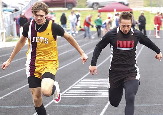 P.C.’s Jesse McLaughlin (right) crosses the line just ahead of Sterling in the boys’ 100 M. Dash prelims. Paula Jasa/Republican