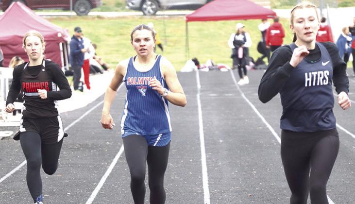 HTRS’ Lily Wamsley (pictured far left) and teammate Makena Dunlap (pictured above right) finish their heat of the girls’ 400 M. Dash along with Pawnee City’s Cara Pierce (pictured above, left). Paula Jasa/Republican