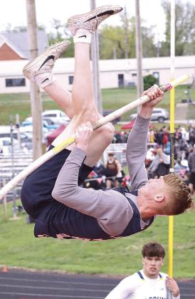 HTRS’ Brogan Dunlap bends the pole for extra leverage in the Pole Vault event as a competitor looks on. Paula Jasa/Republican