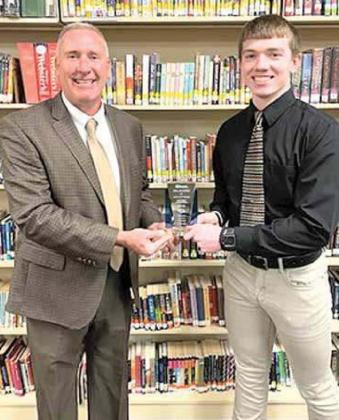 Pictured is Hayden receiving his award from Rick Kentfield-Superintendent of Lewiston Consolidated.