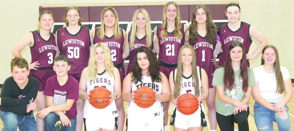 Members of the 2024-25 Lewiston Girls’ Basketball Team are from left: Corbin Crouse, s.m., Owen Wehrbein, s.m., DeLanye Currie, Natasha Ellis, Jenna Anderson, Brooklyn Eggert, s.m., Izzy Meyers, s.m. Back row: Ayden Hunzeker, Vivienne Johnsen, Bryleigh Crouse, Justice Currie, Maddie Janssen, Savannah Cutshall, Sara Wiles. Not pictured: Coaches Allison Nissen and Tracie Wehrbein.