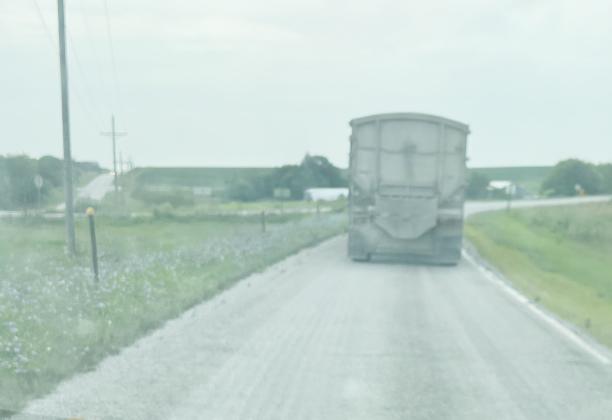 Be sure not to follow the construction equipment too closely. Loose gravel and other material can also create hazards in construction zones.